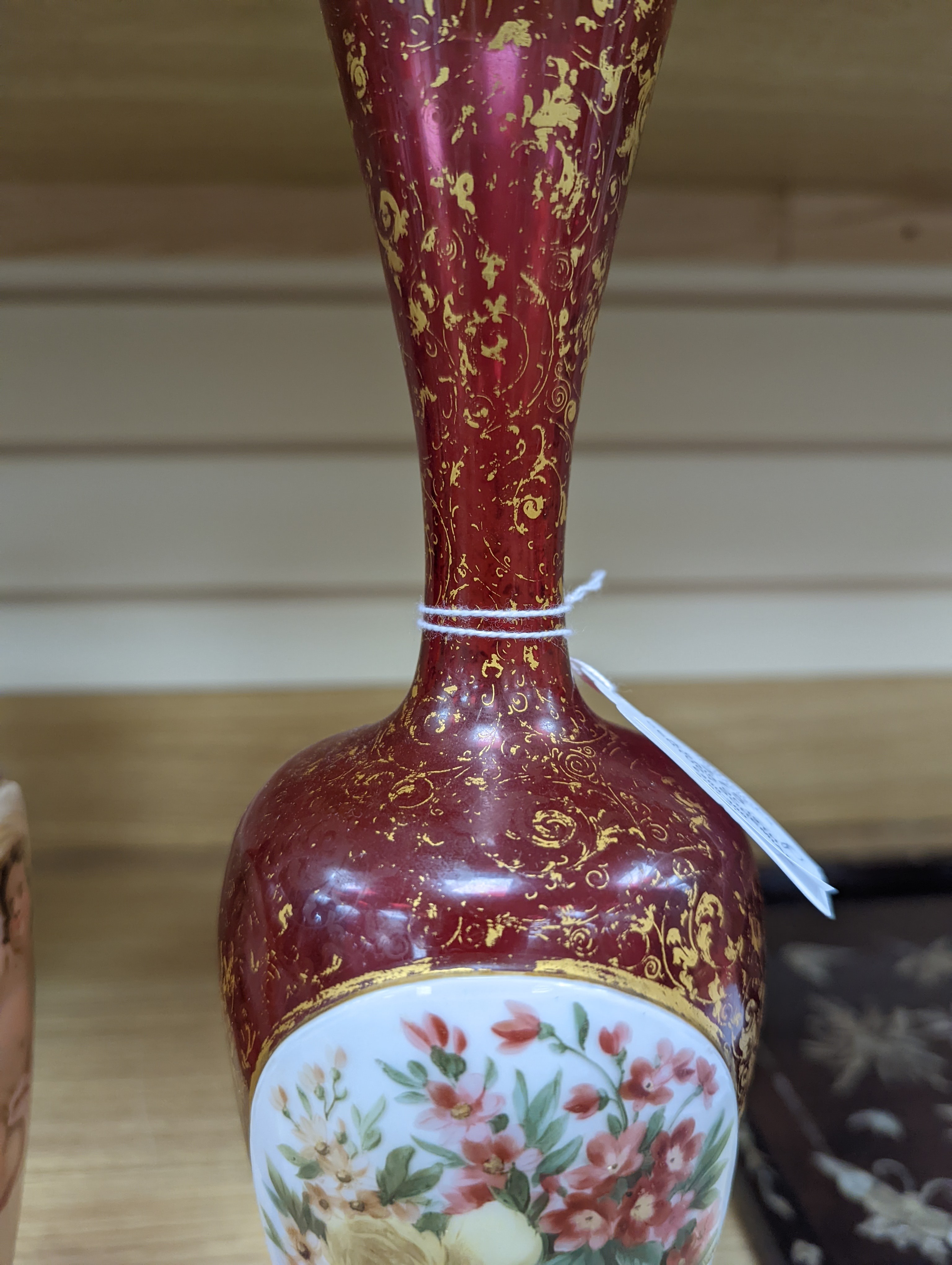 A pair of 19th century Bohemian enamelled and overlaid ruby glass vases 36cm